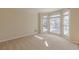Inviting room with ample natural light, plush carpet, and large windows with neutral blinds at 5594 Mountain View Pass, Stone Mountain, GA 30087