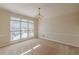 Bright living room with large windows and neutral carpeting offering ample space and natural light at 5594 Mountain View Pass, Stone Mountain, GA 30087