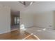 Spacious, light-filled living room with neutral carpet, hardwood flooring, and views to the back deck at 5594 Mountain View Pass, Stone Mountain, GA 30087