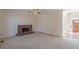 Spacious living room with a brick fireplace and neutral carpeting at 5594 Mountain View Pass, Stone Mountain, GA 30087