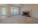 Cozy living room with fireplace, ceiling fan and access to back deck, providing a comfortable space at 5594 Mountain View Pass, Stone Mountain, GA 30087