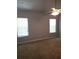 Bedroom with vaulted ceiling, ceiling fan, and windows at 10221 Deep Creek Pl, Union City, GA 30291