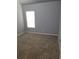 Bedroom with neutral carpet and a window at 10221 Deep Creek Pl, Union City, GA 30291