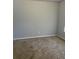 Neutral carpeted bedroom featuring light gray walls at 10221 Deep Creek Pl, Union City, GA 30291