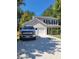 Charming two-story home with an attached garage and well-maintained lawn at 10221 Deep Creek Pl, Union City, GA 30291
