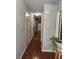 Hallway with hardwood flooring, leading to other rooms in the home at 10221 Deep Creek Pl, Union City, GA 30291