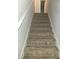 Carpeted stairway leading to the upper level of the home at 10221 Deep Creek Pl, Union City, GA 30291