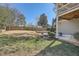 Spacious backyard with a tiered patio, lawn, and mature trees for shade at 2987 Jefferson St, Atlanta, GA 30341