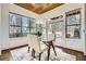 Bright dining area with large windows, hardwood floors, and a glass top table with seating for four at 2987 Jefferson St, Atlanta, GA 30341