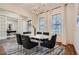 Elegant dining room featuring a modern chandelier, round table, and views of the office space at 2987 Jefferson St, Atlanta, GA 30341