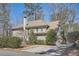 Beautiful home with a paved driveway, attached garage, and a well-maintained yard surrounded by mature trees at 2987 Jefferson St, Atlanta, GA 30341