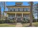 Charming two-story home featuring a welcoming front porch with white columns and landscaped yard at 2987 Jefferson St, Atlanta, GA 30341