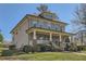Charming two-story home featuring a welcoming front porch, well-maintained lawn, and mature landscaping at 2987 Jefferson St, Atlanta, GA 30341