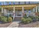 Inviting front porch with white railing, brick accents, and well-maintained landscaping leading to the front door at 2987 Jefferson St, Atlanta, GA 30341