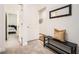 Inviting hallway with a bench, coat rack, and views into the bedroom, with plush carpet at 2987 Jefferson St, Atlanta, GA 30341