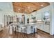 Bright kitchen with granite countertops, wooden ceiling, stainless steel appliances, and an island with bar seating at 2987 Jefferson St, Atlanta, GA 30341