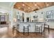 Modern kitchen with white cabinets, granite countertops, stainless steel appliances, and a wood plank ceiling at 2987 Jefferson St, Atlanta, GA 30341