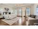 Spacious primary bedroom suite with tray ceilings, hardwood floors, and abundant natural light from three windows at 2987 Jefferson St, Atlanta, GA 30341