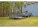 View of the tiered wooden deck with blue railings overlooking the yard at 3430 Pate Rd, Snellville, GA 30078