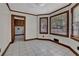 Bright breakfast nook with white tile flooring, wood trim, and large windows for natural light at 3430 Pate Rd, Snellville, GA 30078