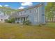Side view of a light-blue two-story home with white trim and a covered front porch at 3430 Pate Rd, Snellville, GA 30078