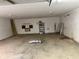 View of the garage interior with a concrete floor and white walls at 3430 Pate Rd, Snellville, GA 30078