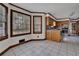 Bright kitchen with tile floors, wooden trim, natural light, and stainless steel appliances at 3430 Pate Rd, Snellville, GA 30078