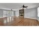 Spacious living room with hardwood floors, stone fireplace, and access to outdoor deck at 3430 Pate Rd, Snellville, GA 30078
