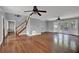 Living room with hardwood flooring, staircase, grey walls, and access to outdoor deck at 3430 Pate Rd, Snellville, GA 30078