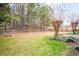 The spacious backyard includes a fire pit, mature trees and manicured landscaping, creating a perfect outdoor retreat at 5952 Edenfield Nw Dr, Acworth, GA 30101