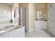 Well-lit bathroom with double sink vanity and white tile flooring at 5952 Edenfield Nw Dr, Acworth, GA 30101