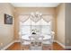 Cozy dining area with hardwood floors, bright light and a chandelier at 5952 Edenfield Nw Dr, Acworth, GA 30101