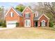 Charming two-story brick home with a well-maintained lawn and attached two-car garage at 5952 Edenfield Nw Dr, Acworth, GA 30101