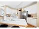 Bright kitchen with white cabinets, stainless steel appliances, and an eat-in island at 5952 Edenfield Nw Dr, Acworth, GA 30101