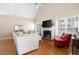 Bright living room features a fireplace, hardwood floors, and lots of natural light at 5952 Edenfield Nw Dr, Acworth, GA 30101