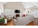 Living room with vaulted ceiling, hardwood floors, fireplace, and lots of natural light at 5952 Edenfield Nw Dr, Acworth, GA 30101