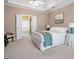 Comfortable main bedroom boasting tray ceilings, neutral color palette and access to ensuite bathroom at 5952 Edenfield Nw Dr, Acworth, GA 30101