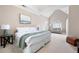 Spacious main bedroom with a seating area, carpet floors and a vaulted ceiling at 5952 Edenfield Nw Dr, Acworth, GA 30101