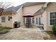 Charming outdoor patio with grill, seating, and umbrella, perfect for al fresco dining and entertaining at 5952 Edenfield Nw Dr, Acworth, GA 30101