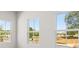 Bedroom featuring three large windows, flooding the room with natural light at 7 Hydrangea Unit 70 Way, Auburn, GA 30011