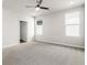Spacious bedroom with carpet, ceiling fan, and windows at 7 Hydrangea Unit 70 Way, Auburn, GA 30011