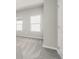 Bedroom featuring carpet floors, neutral paint and bright windows at 7 Hydrangea Unit 70 Way, Auburn, GA 30011