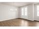 Dining room featuring hardwood floors and modern chandelier at 7 Hydrangea Unit 70 Way, Auburn, GA 30011