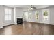 Bright living room featuring hardwood floors, fireplace, and ample natural light at 7 Hydrangea Unit 70 Way, Auburn, GA 30011