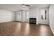 Bright living room featuring hardwood floors, fireplace, and ceiling fan at 7 Hydrangea Unit 70 Way, Auburn, GA 30011