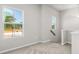 Bright loft space with large windows, carpeted floors and neutral paint at 7 Hydrangea Unit 70 Way, Auburn, GA 30011