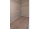 Walk-in closet featuring a large open storage area with shelving and a carpet floor at 10 Chapman Way, Covington, GA 30016