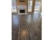 Bright living room with fireplace, offering a cozy space for relaxation and entertainment with luxury vinyl flooring at 10 Chapman Way, Covington, GA 30016