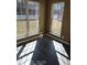 Bright room with large windows providing ample natural light, showcasing the newly installed luxury vinyl flooring at 10 Chapman Way, Covington, GA 30016