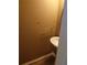Compact powder room features a pedestal sink, towel rack and wood-look flooring at 10 Chapman Way, Covington, GA 30016